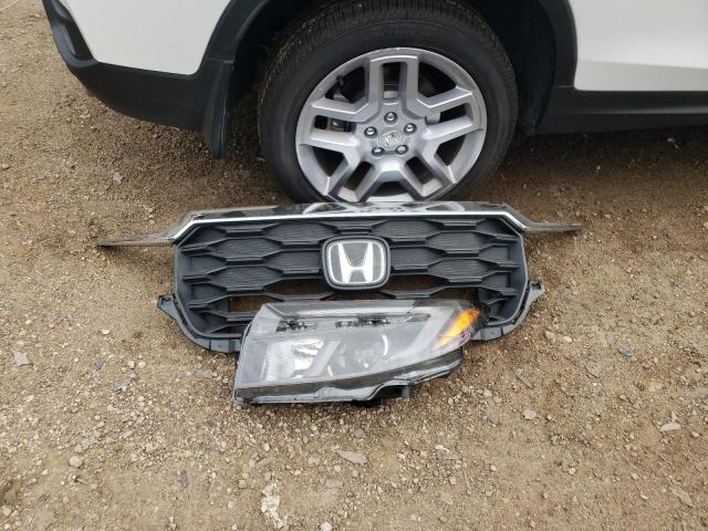 Photo 12 from auction – 2024 HONDA PASSPORT E with VIN 5FNYF8H56RB009638
