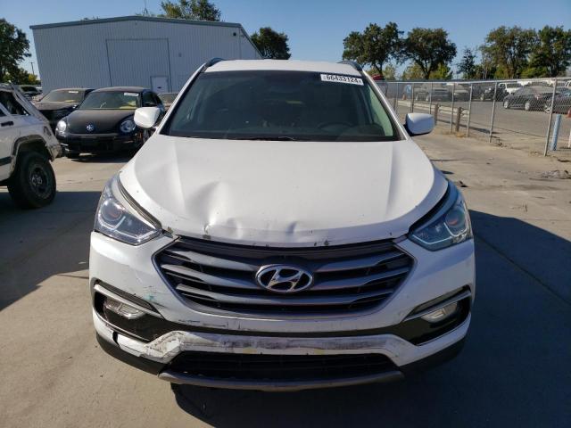 Photo 5 from auction – 2017 HYUNDAI SANTA FE S with VIN 5NMZU3LB0HH003132