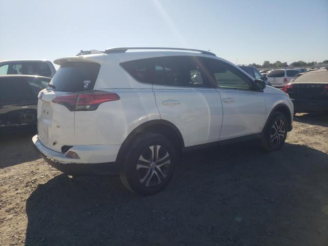 Photo 3 from auction – 2018 TOYOTA RAV4 LE with VIN JTMZFREV8JJ201302