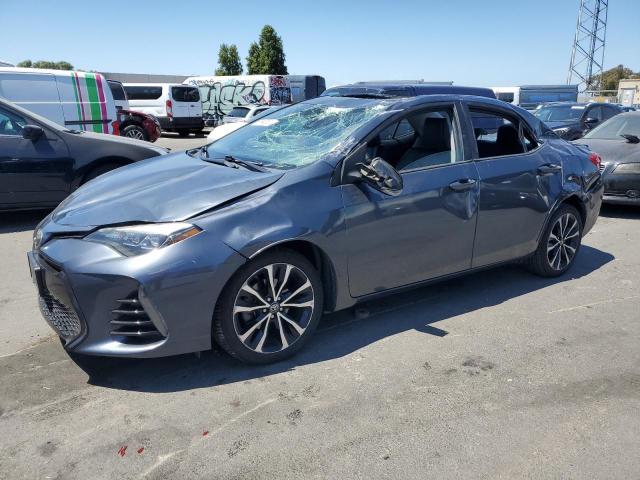TOYOTA COROLLA L 2017 with VIN 5YFBURHE8HP693077 - Photo from auction