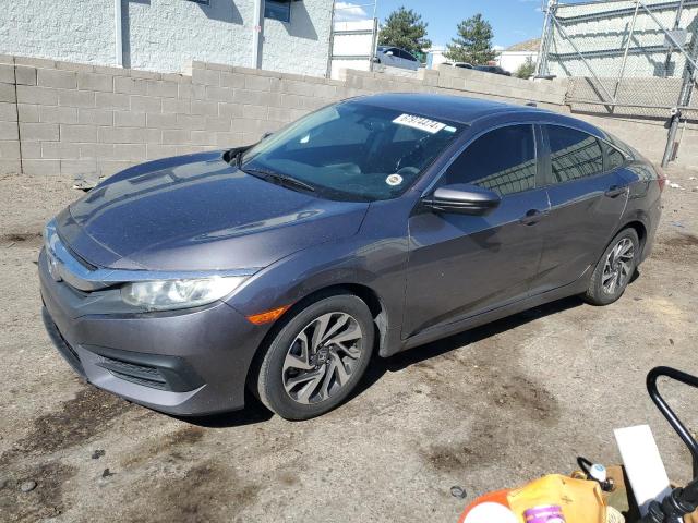HONDA CIVIC EX 2018 with VIN 19XFC2F70JE040914 - Photo from auction