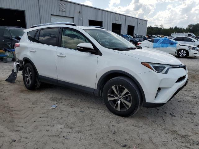 Photo 4 from auction – 2017 TOYOTA RAV4 XLE with VIN JTMRFREV4HJ173038