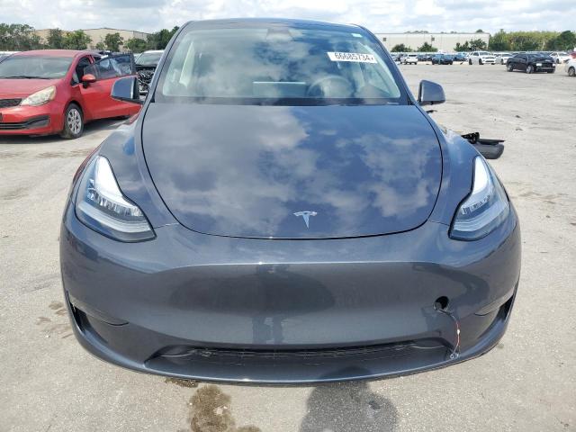 Photo 5 from auction – 2023 TESLA MODEL Y with VIN 7SAYGDEE2PA092329
