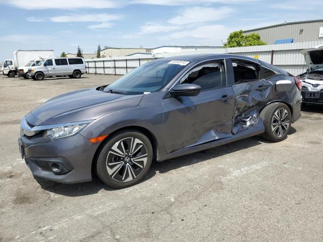 HONDA CIVIC EX 2018 with VIN JHMFC1F46JX015904 - Photo from auction