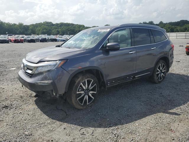 HONDA PILOT TOUR 2022 with VIN 5FNYF6H97NB016261 - Photo from auction