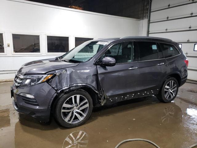 HONDA PILOT TOUR 2018 with VIN 5FNYF6H94JB033562 - Photo from auction