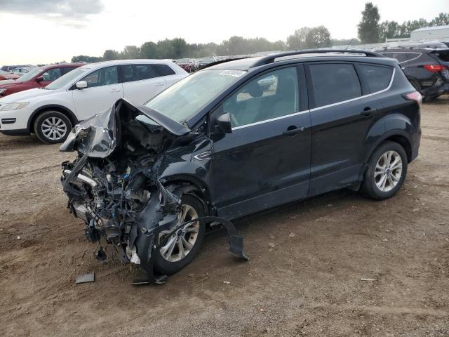 FORD ESCAPE SE 2018 with VIN 1FMCU9GDXJUB23065 - Photo from auction