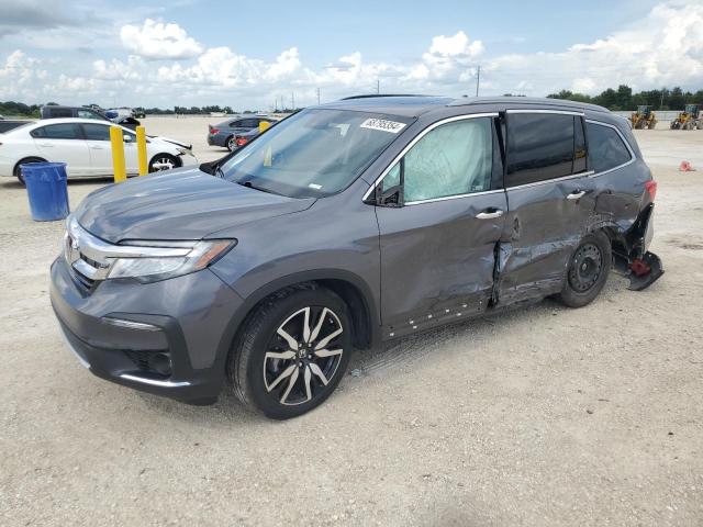 HONDA PILOT TOUR 2022 with VIN 5FNYF5H65NB031499 - Photo from auction