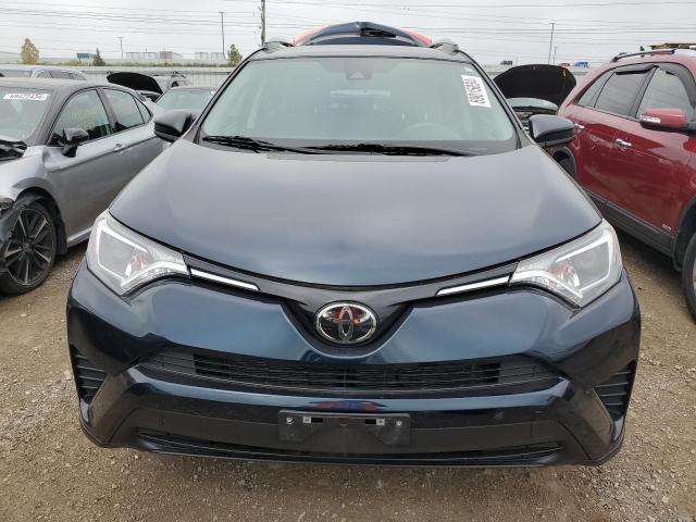 Photo 5 from auction – 2018 TOYOTA RAV4 LE with VIN 2T3BFREV3JW760405
