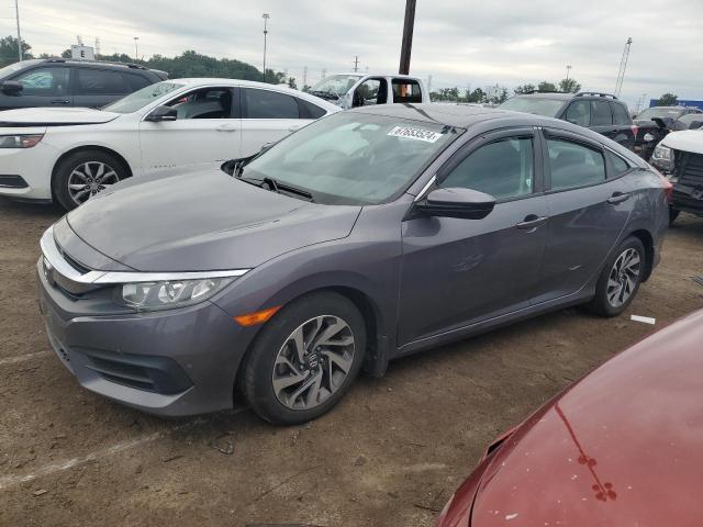 HONDA CIVIC EX 2018 with VIN 2HGFC2F74JH605123 - Photo from auction