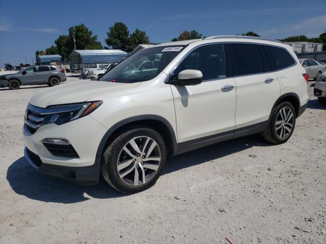 HONDA PILOT TOUR 2018 with VIN 5FNYF5H93JB008906 - Photo from auction