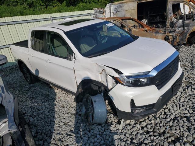 Photo 4 from auction – 2023 HONDA RIDGELINE with VIN 5FPYK3F52PB050984