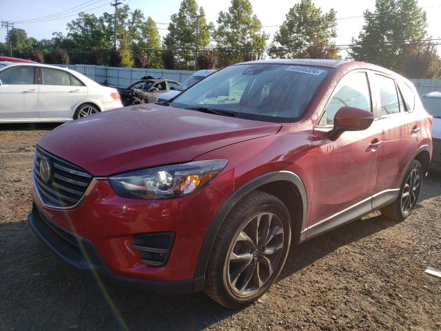 MAZDA CX-5 GT 2016 with VIN JM3KE4DYXG0693677 - Photo from auction