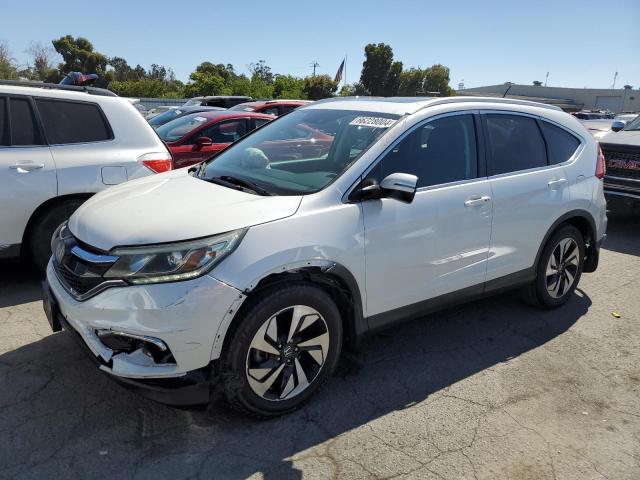 HONDA CR-V TOURI 2016 with VIN 5J6RM3H93GL032637 - Photo from auction