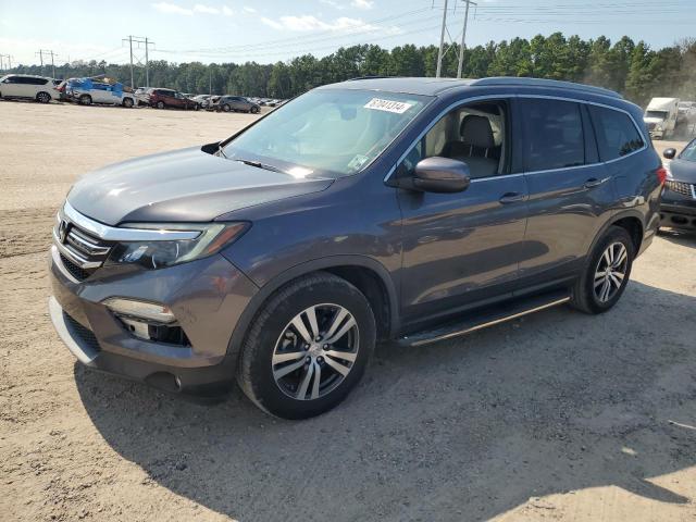 HONDA PILOT EXL 2018 with VIN 5FNYF5H57JB015810 - Photo from auction