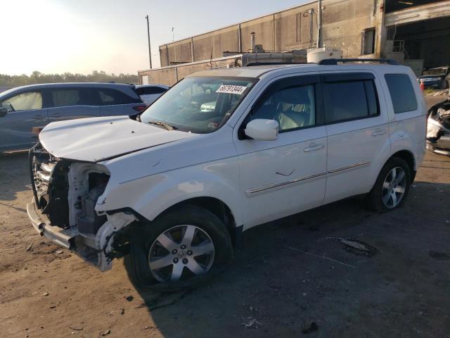 HONDA PILOT TOUR 2013 with VIN 5FNYF4H96DB076132 - Photo from auction