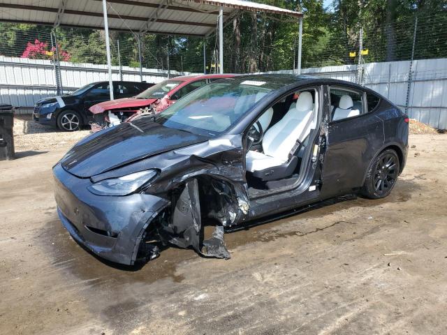 TESLA MODEL Y 2024 with VIN 7SAYGDED0RF015097 - Photo from auction