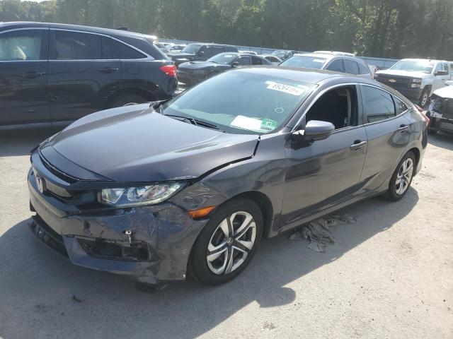 HONDA CIVIC LX 2018 with VIN 2HGFC2F55JH601970 - Photo from auction