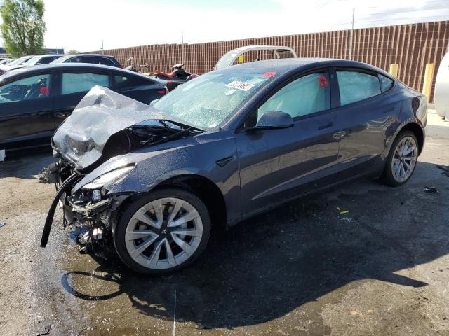 TESLA MODEL 3 2022 with VIN 5YJ3E1EAXNF303950 - Photo from auction