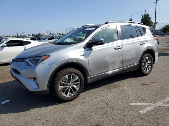 TOYOTA RAV4 HV LE 2018 with VIN JTMRJREV9JD189092 - Photo from auction