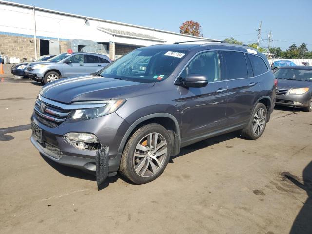 HONDA PILOT TOUR 2018 with VIN 5FNYF6H97JB012141 - Photo from auction