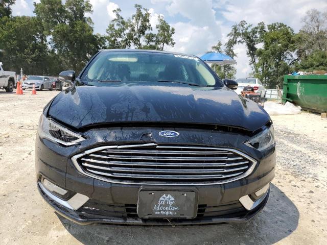 Photo 5 from auction – 2018 FORD FUSION TIT with VIN 3FA6P0D95JR128272