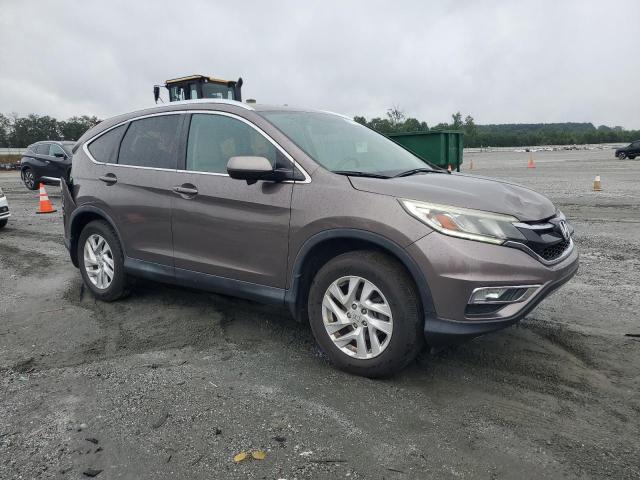 Photo 4 from auction – 2015 HONDA CR-V with VIN 2HKRM4H71FH611235