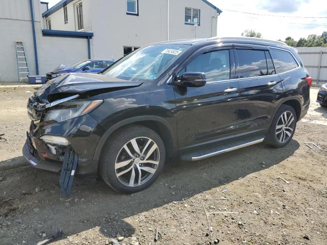 HONDA PILOT TOUR 2016 with VIN 5FNYF6H95GB020635 - Photo from auction
