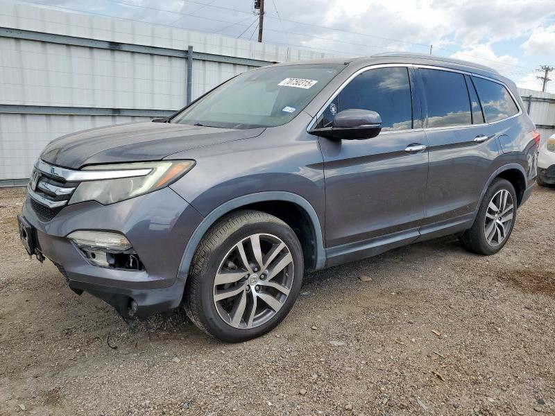 HONDA PILOT TOUR 2017 with VIN 5FNYF5H99HB006569 - Photo from auction