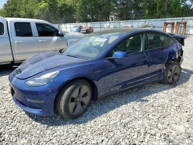 TESLA MODEL 3 2023 with VIN 5YJ3E1EB7PF654164 - Photo from auction