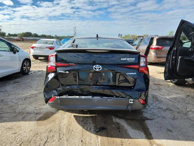 Photo 6 from auction – 2021 TOYOTA PRIUS with VIN JTDKAMFU2M3150221