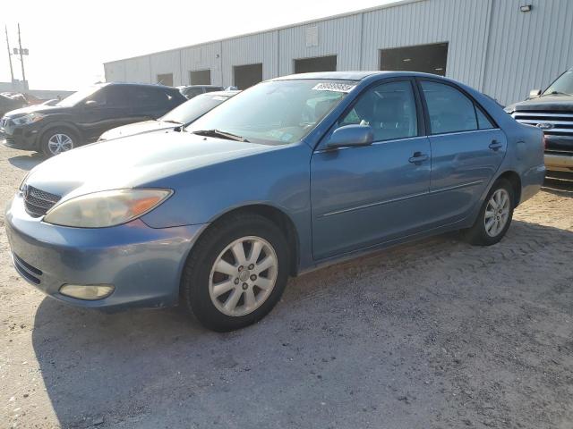TOYOTA CAMRY LE 2003 with VIN 4T1BE30KX3U777517 - Photo from auction