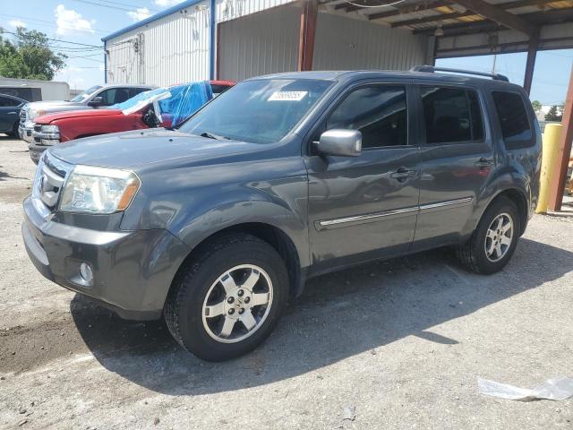 HONDA PILOT TOUR 2011 with VIN 5FNYF4H98BB024420 - Photo from auction