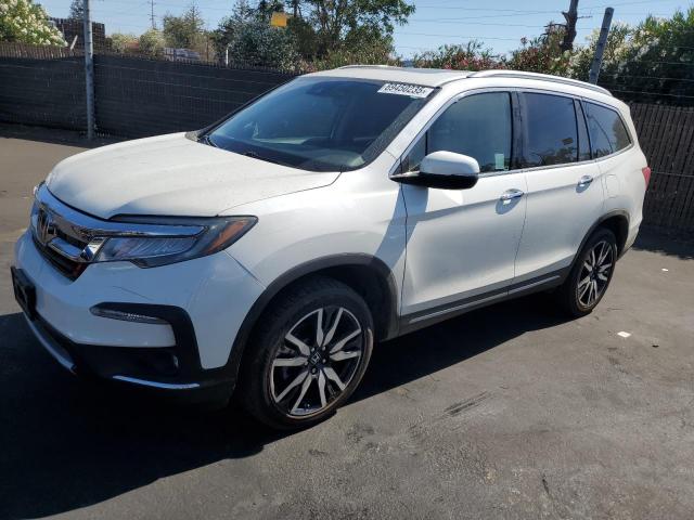 HONDA PILOT TOUR 2019 with VIN 5FNYF6H94KB071097 - Photo from auction