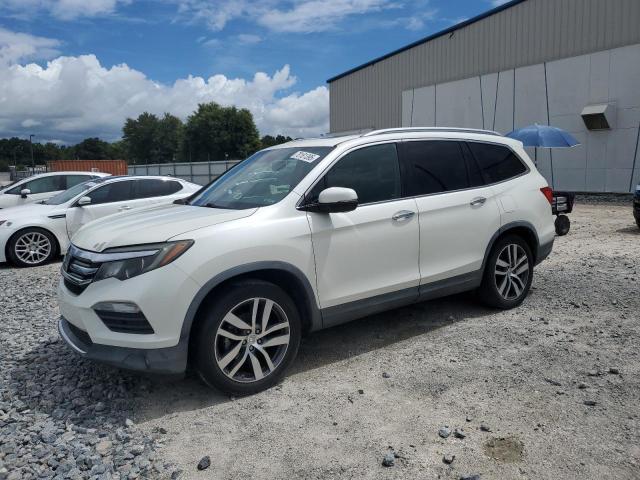 HONDA PILOT TOUR 2016 with VIN 5FNYF5H96GB001179 - Photo from auction