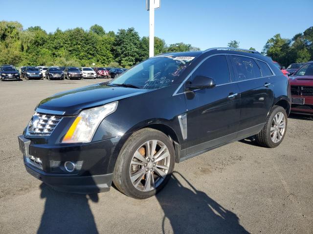CADI SRX PREMIUM COLLECTION 2015 with VIN 3GYFNGE30FS528740 - Photo from auction