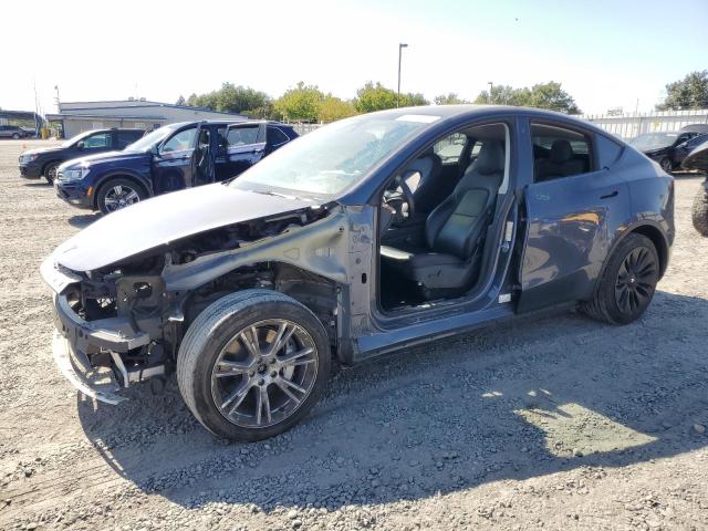 TESLA MODEL Y 2023 with VIN 7SAYGAEE4PF744787 - Photo from auction