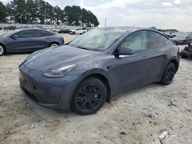 TESLA MODEL Y 2023 with VIN 7SAYGDEE7PF668239 - Photo from auction