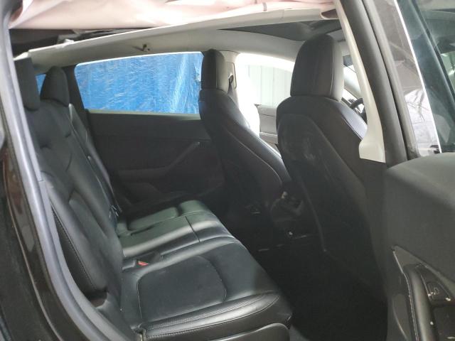 Photo 11 from auction – 2022 TESLA MODEL Y with VIN 7SAYGAEE6NF323926