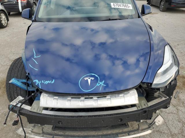 Photo 11 from auction – 2022 TESLA MODEL Y with VIN 7SAYGAEE2NF362819