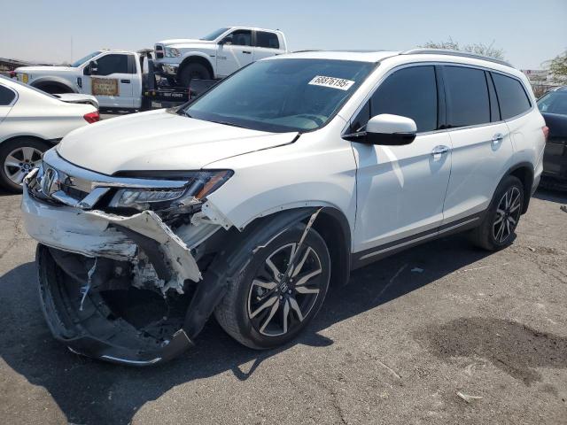 HONDA PILOT TOURING 2022 with VIN 5FNYF5H64NB020140 - Photo from auction