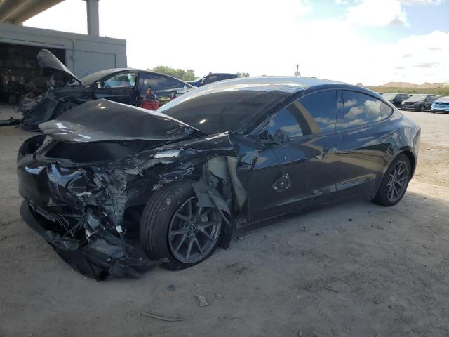 TESLA MODEL 3 2023 with VIN 5YJ3E1EAXPF670348 - Photo from auction