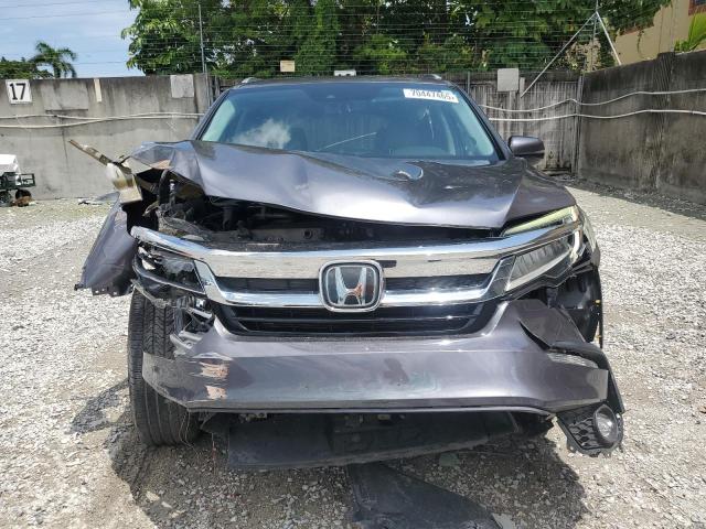 Photo 5 from auction – 2021 HONDA PILOT TOURING with VIN 5FNYF5H95MB011570