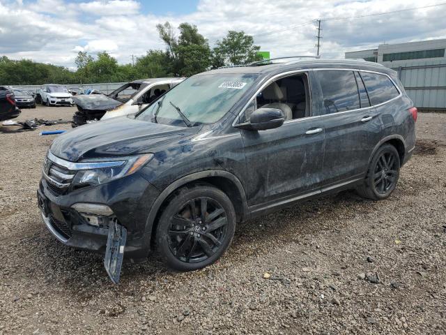 HONDA PILOT TOUR 2017 with VIN 5FNYF5H98HB037490 - Photo from auction