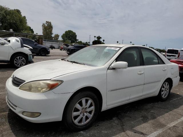 TOYOTA CAMRY LE 2003 with VIN JTDBE32K830234238 - Photo from auction
