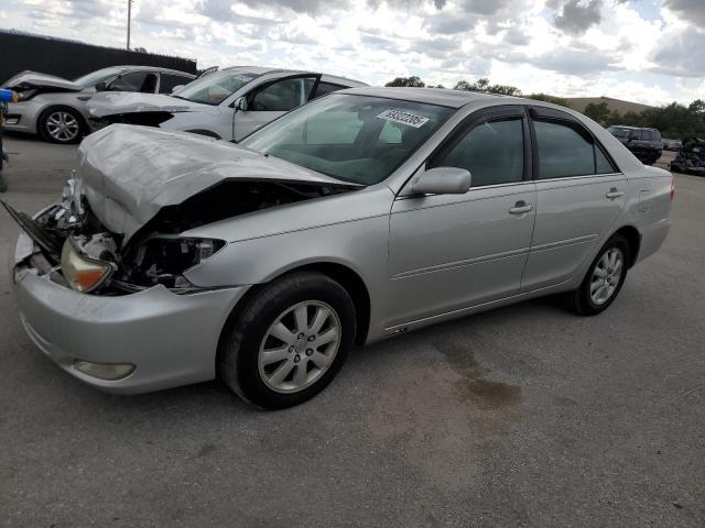 TOYOTA CAMRY LE 2004 with VIN 4T1BF30K14U571484 - Photo from auction