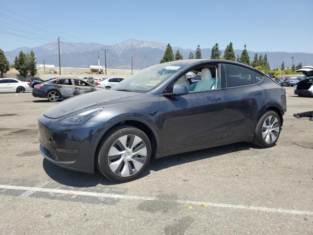 TESLA MODEL Y 2024 with VIN 7SAYGDED9RF011128 - Photo from auction