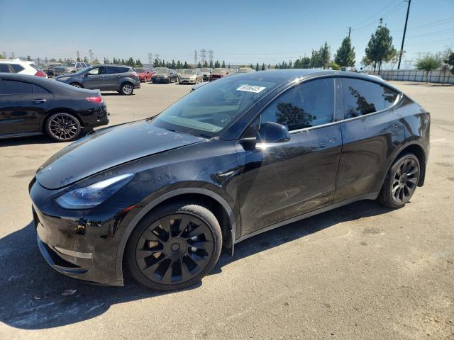 TESLA MODEL Y 2022 with VIN 7SAYGAEE4NF559698 - Photo from auction