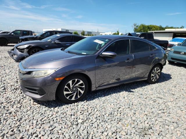 HONDA CIVIC EX 2018 with VIN 19XFC2F79JE009421 - Photo from auction