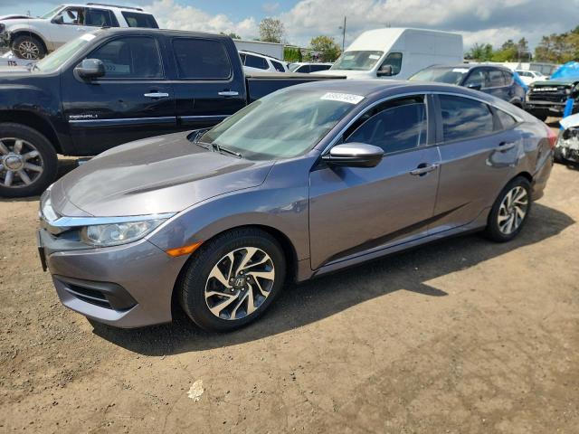 HONDA CIVIC EX 2017 with VIN 2HGFC2F74HH545273 - Photo from auction